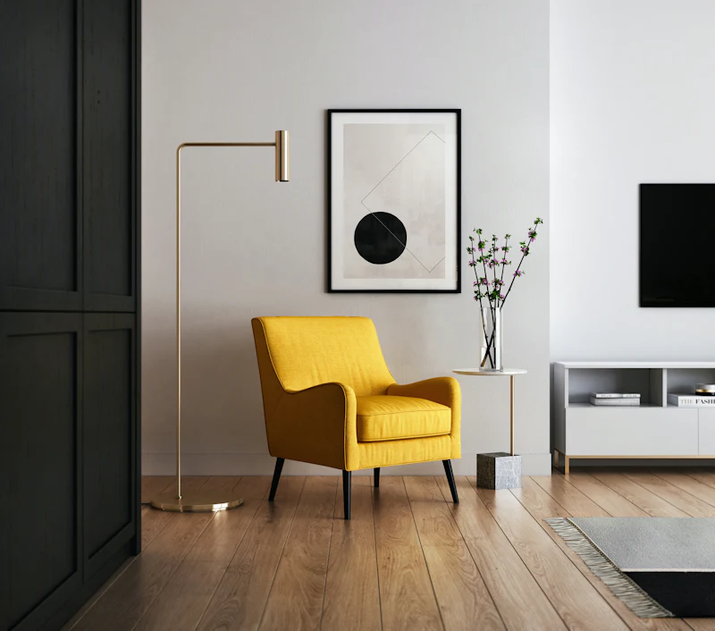 Bright living room with light wood-effect flooring and a yellow armchair