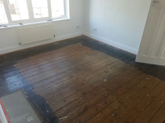 Before: the original bare floorboards