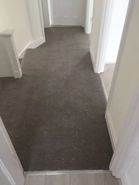 Charcoal carpet through a landing