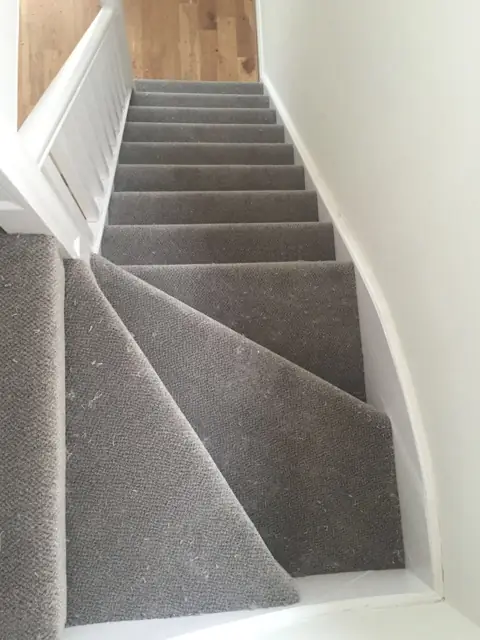 Grey carpet, quarter-turn stairs